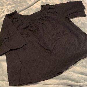 Black top with eyelet type material